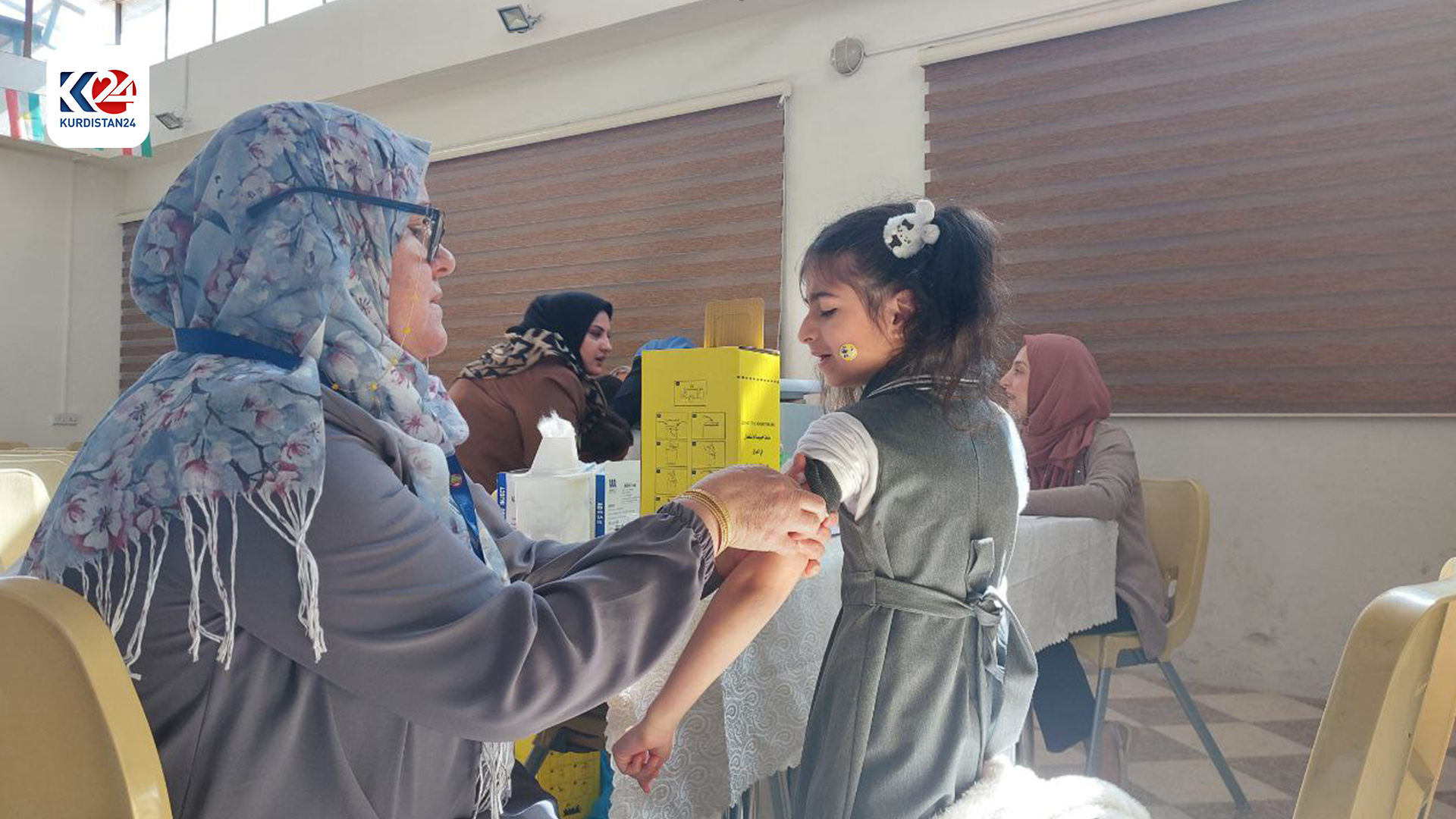 A nurse administrating the vaccine.